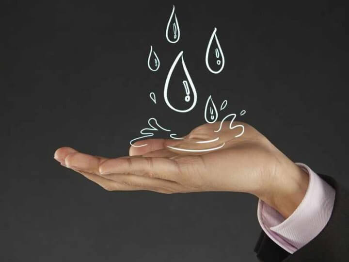 cartoon water drops on photo hand