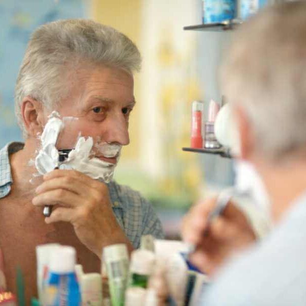 older man shaving