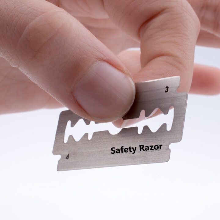  A close-up of a razor blade with the words "Safety Razor" written on it