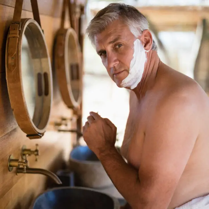 older man shaving