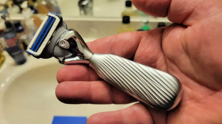 gillette baldy razor in hand