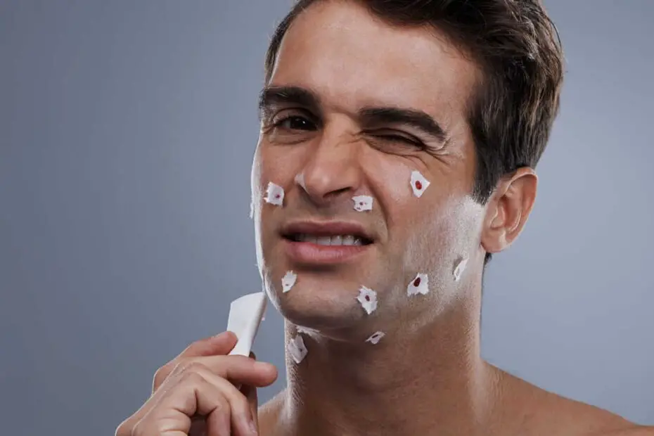 man with shaving cuts on face