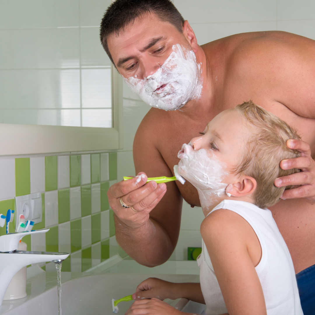 man teaching boy to shave