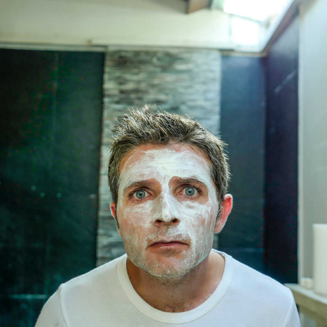 man washing face