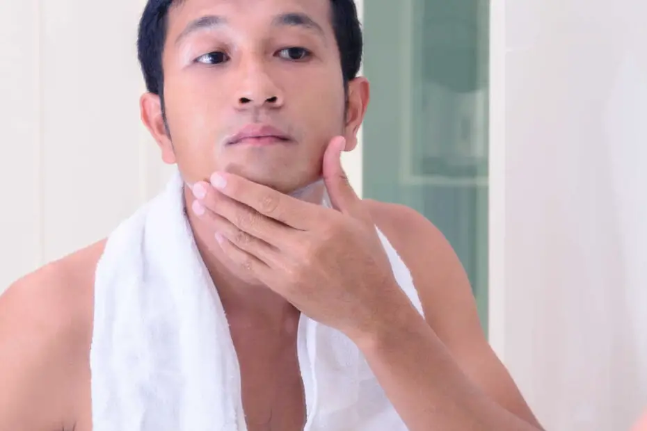 man applying product to face