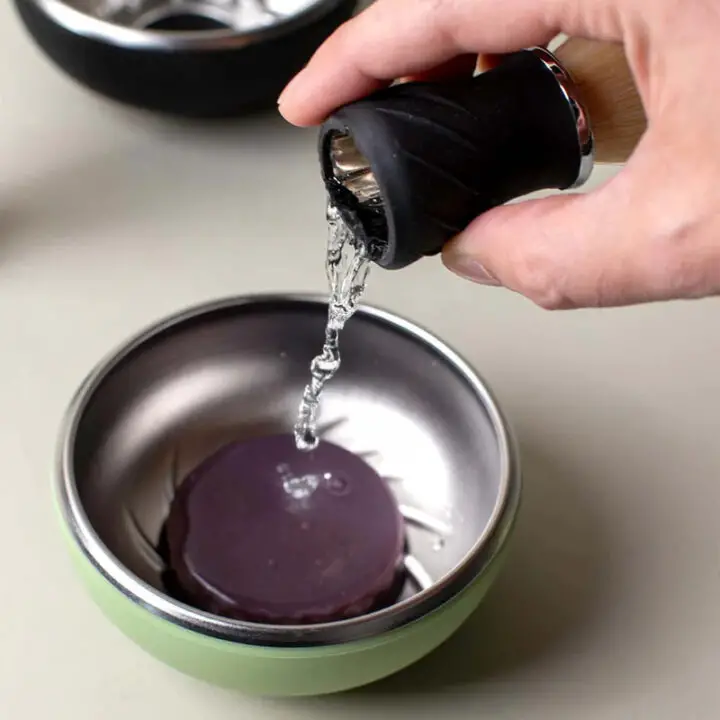 loading water from leaf brush into leaf soap and bowl