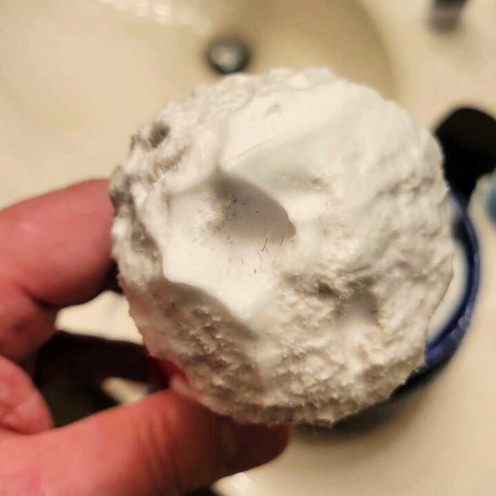 closeup of shaving brush loaded with lather