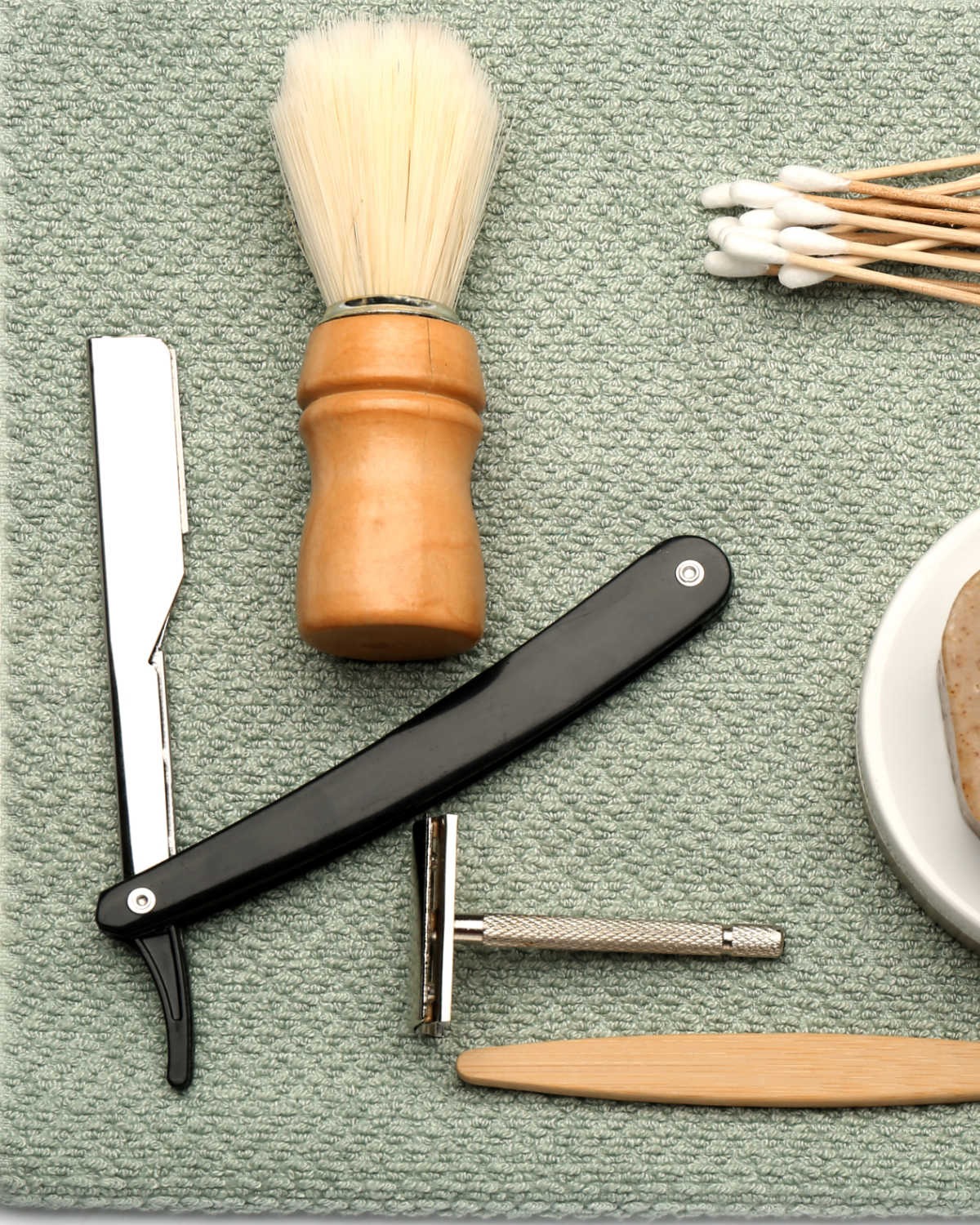 shaving tools on a towel
