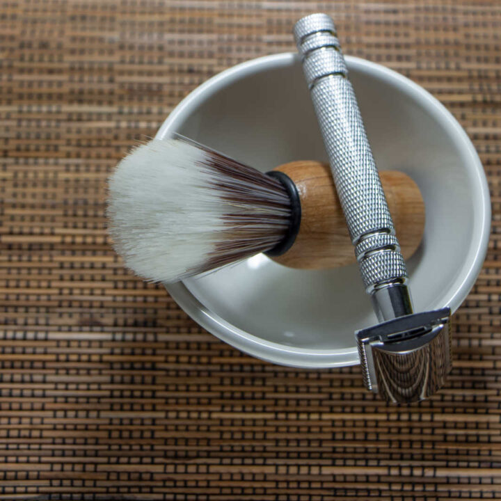 razor, brush, and bowl resting on countertop
